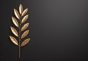 golden leaf branch on black background photo