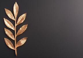 golden leaves on dark background photo