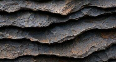 Textured rock surface with natural patterns and cracks photo