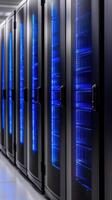 Rows of illuminated server racks in a data center photo