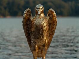 golden eagle statue with outstretched wings photo
