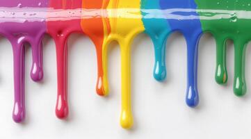 Colorful paint dripping down a white background photo