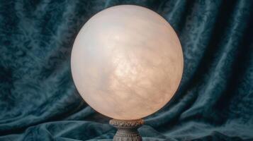 Glowing crystal ball on ornate stand photo
