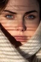 Closeup of a womans face with blue eyes and makeup photo