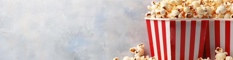 Delicious popcorn in a striped box photo