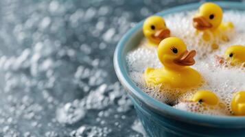Cute yellow rubber ducks in a bubbly bath photo