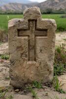 ancient religious cross carved in stone photo