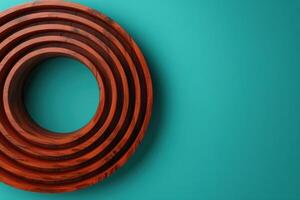 Stacked wooden rings on turquoise background photo