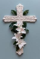 Ornate cross with white lilies photo