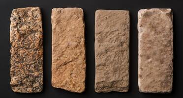 Assortment of ancient stone tools on black background photo