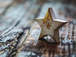 Rustic wooden star ornament on weathered wooden surface photo