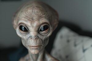 Alien face close up with large eyes and wrinkled skin photo