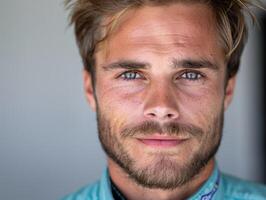 close up portrait of a man with a beard and piercing blue eyes photo