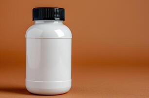 white plastic bottle with black cap on orange background photo
