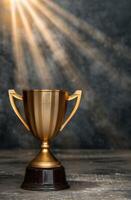 golden trophy on wooden surface with dramatic lighting photo