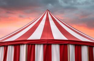 Vibrant circus tent against dramatic sky photo