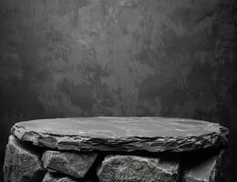 Rugged stone platform on dark background photo