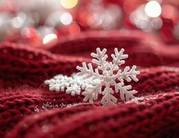 Sparkling snowflake on red fuzzy fabric photo