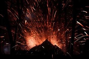 Dramatic fireworks display over a mountain silhouette photo