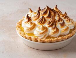 Delicious lemon meringue pie with golden brown meringue topping photo