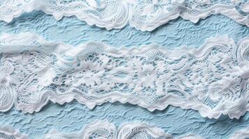 Delicate lace pattern on soft blue background photo