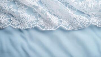 Delicate lace texture on soft blue background photo