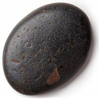 Closeup of a dark, textured stone or rock photo