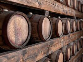 Wooden barrels in a rustic wine cellar photo