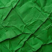 Crumpled green paper texture background photo