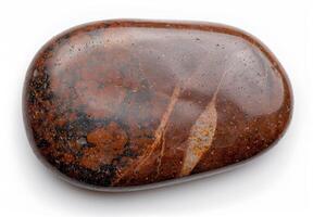 Closeup of a smooth, polished stone with natural patterns and textures photo