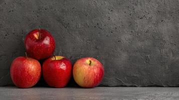 Assorted red apples on a dark background photo