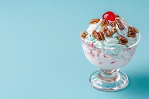 Delicious ice cream sundae with whipped cream and pecans photo