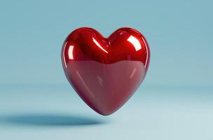 Glossy red heart on blue background photo