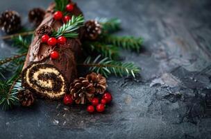 Festive Christmas chocolate cake roll with pine branches and berries photo