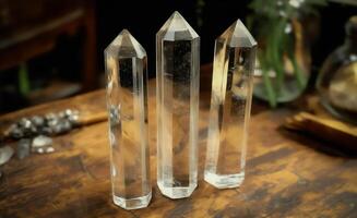 Three transparent clear crystals placed elegantly on a textured table photo