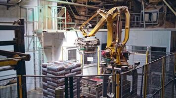 Industrial robot. Robotic arm working on the modern plant. Automated production in factory. Manufacturing workshop. video