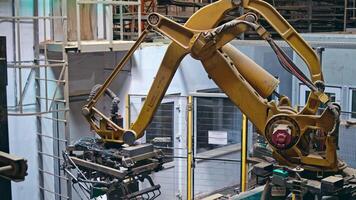 Mechanical robot with artificial intelligence sorts bags on the conveyor. Putting bags from line to the pallet. Process closeup. video