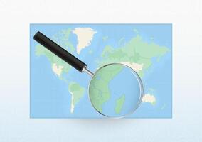 Map of the World with a magnifying glass aimed at Comoros, searching Comoros with loupe. vector