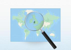 Map of the World with a magnifying glass aimed at Wales, searching Wales with loupe. vector
