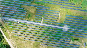 Ecological power plant in summer. Top view on the solar panels on the field. Renewable energy. Alternative source of electricity. Aerial view. Camera moves around. video