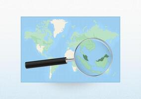 Map of the World with a magnifying glass aimed at Malaysia, searching Malaysia with loupe. vector