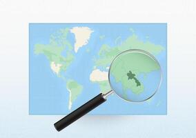 Map of the World with a magnifying glass aimed at Laos, searching Laos with loupe. vector