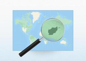 Map of the World with a magnifying glass aimed at Afghanistan, searching Afghanistan with loupe. vector