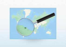Map of the World with a magnifying glass aimed at Suriname, searching Suriname with loupe. vector