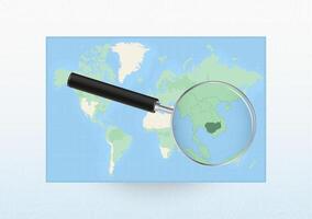 Map of the World with a magnifying glass aimed at Cambodia, searching Cambodia with loupe. vector