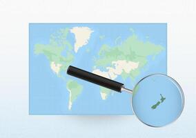 Map of the World with a magnifying glass aimed at New Zealand, searching New Zealand with loupe. vector