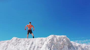 Professional bodybuilder posing. Concept of sport outdoors. Aerial view. video