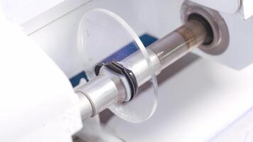 Eyeglass lens is inserted into a machine. Production of lens for spectacles with new technology. Close-up. video
