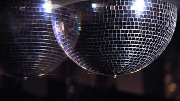 Shiny disco mirror ball turning in seamless loop. Rotating mirror disco ball shimmering in the hall. Mirror ball spins clockwise. video