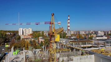 Construction site with a bird's eye in a megacity. shooting with drone. New office in a new residential complex. Aerial view. video